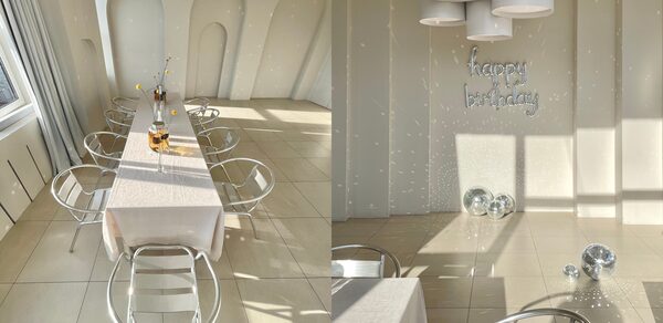 Роскошный панорамный лофт . Панорамные окна, залитые солнечным светом. Стол со стульями. Кровать. Диван с журнальным столиком