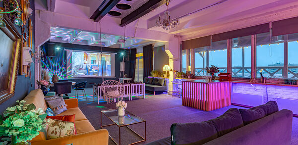 Stylized loft with high ceilings and a veranda