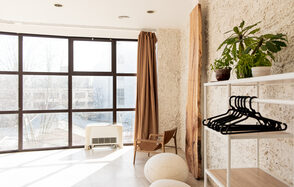 White hall with a staircase and a panoramic window