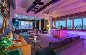 Stylized loft with high ceilings and a veranda